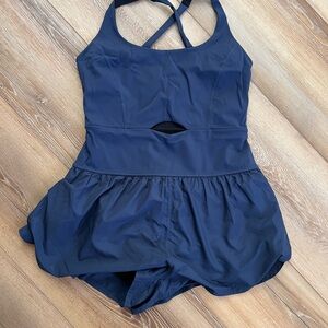Free People Movement Righteous Runsie in a navy blue color